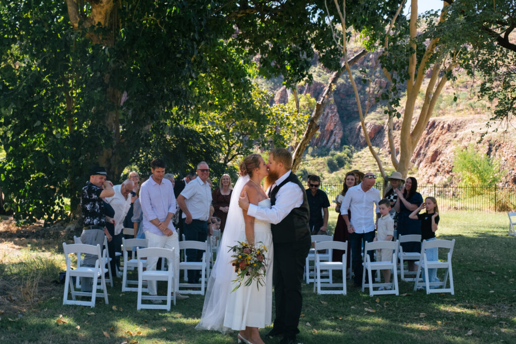 bride and groom kissing at Lake Argyle Wedding ceremony