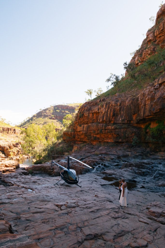 helicopter adventure wedding couple exploring Lake Argyle waterfalls